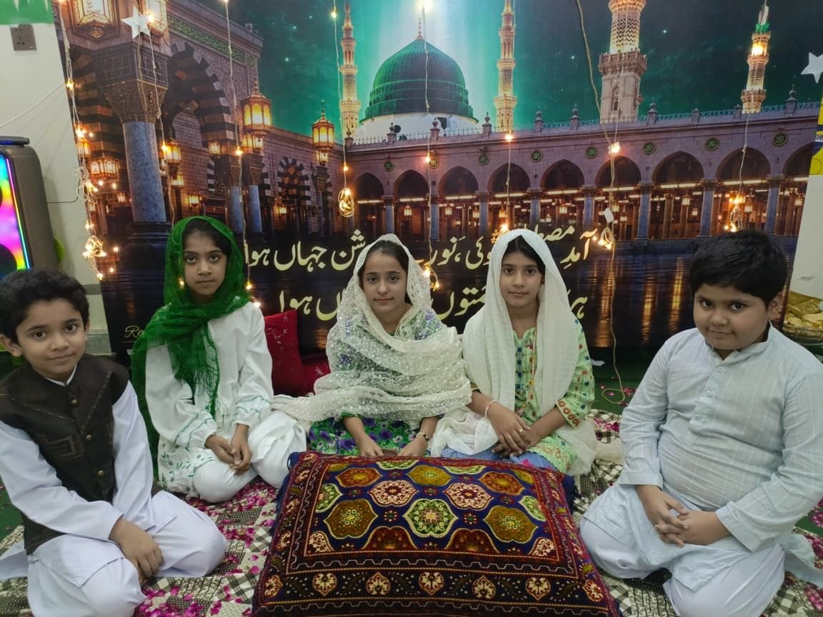 Students seated at the Milad-un-Nabi gathering