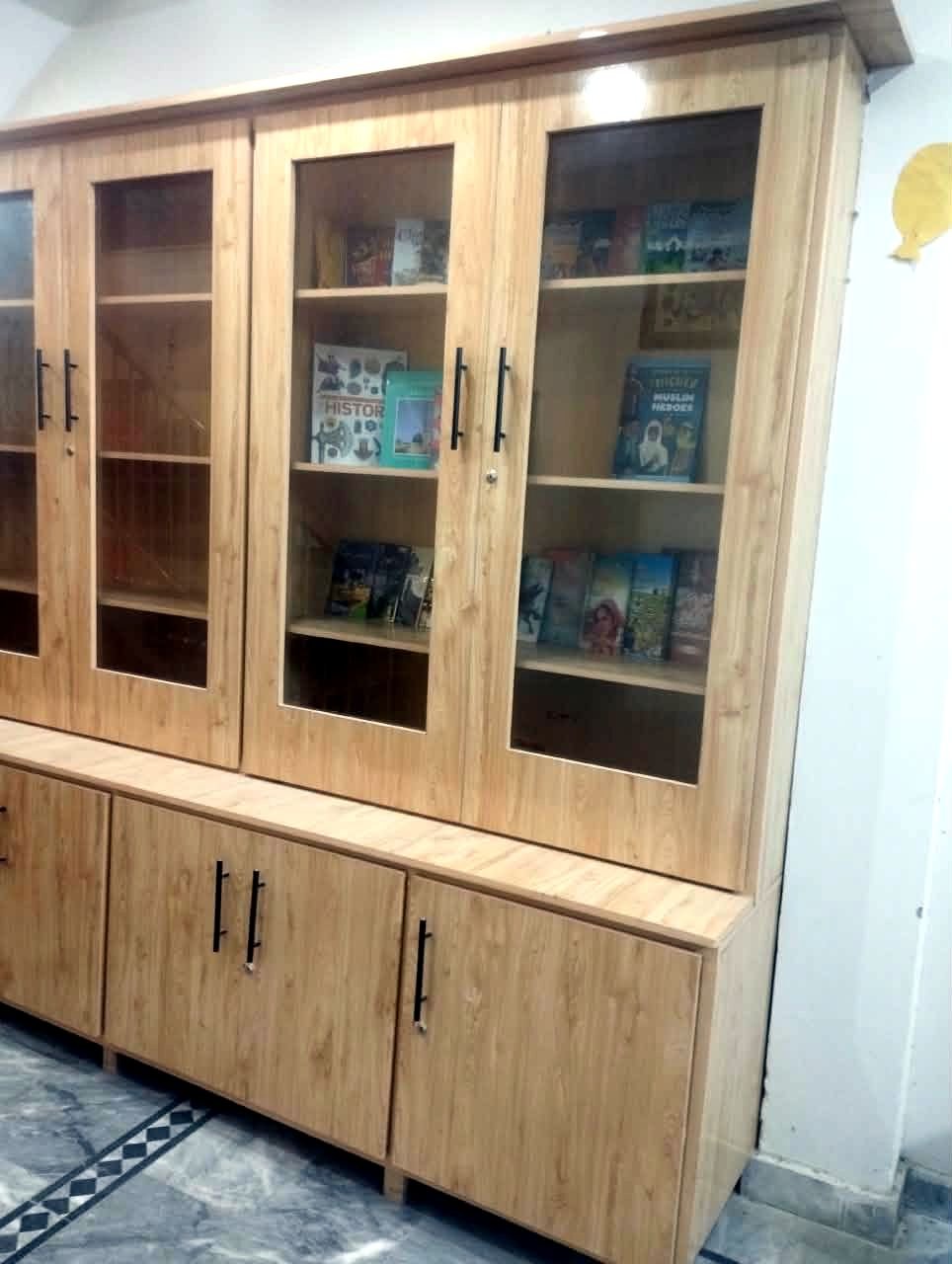 Library cabinets with books on display